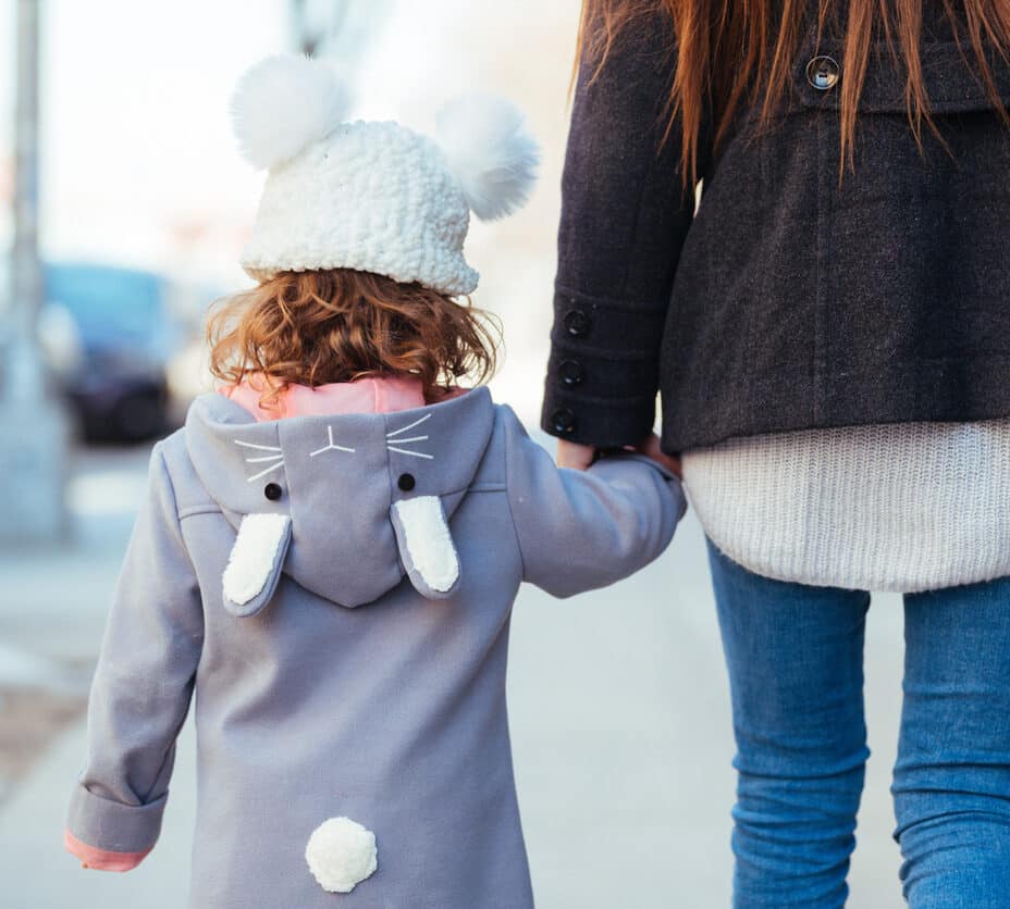 Mother and Daughter Walking together holding hands
